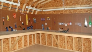 Pine Creek Structures interior options: pegboard and workbench